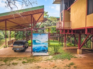 Mural on outdoor shower between carport and guesthouse