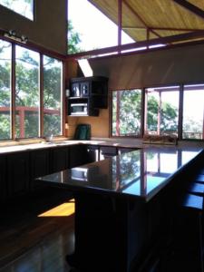 Kitchen has a long island with seating for 10